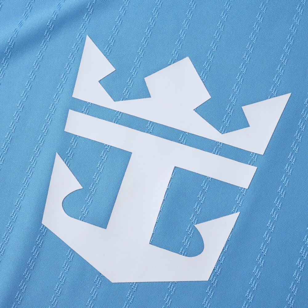 Close-up of the white Inter Miami CF crest on the blue 2025/26 Third Player Version jersey fabric.