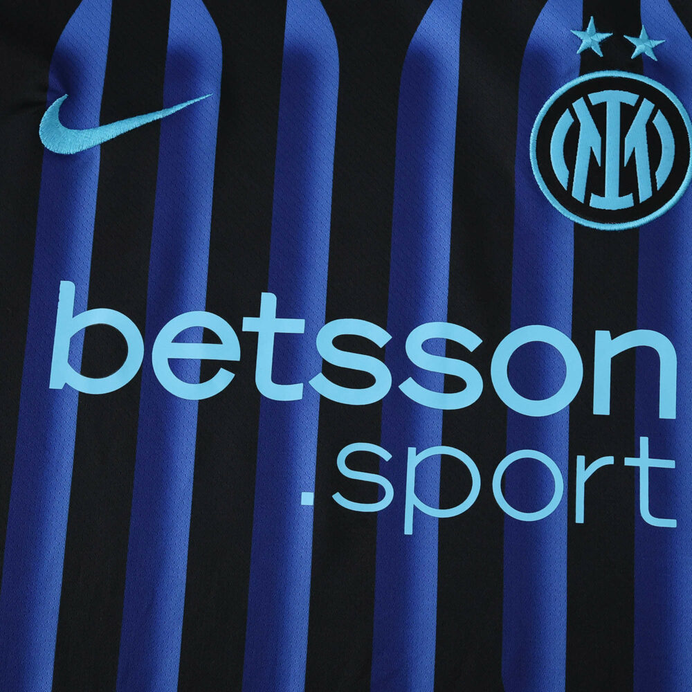 Close-up of Inter Milan 2025/26 Home Fan Jersey showing club crest, Nike logo, and betsson.sport sponsor.