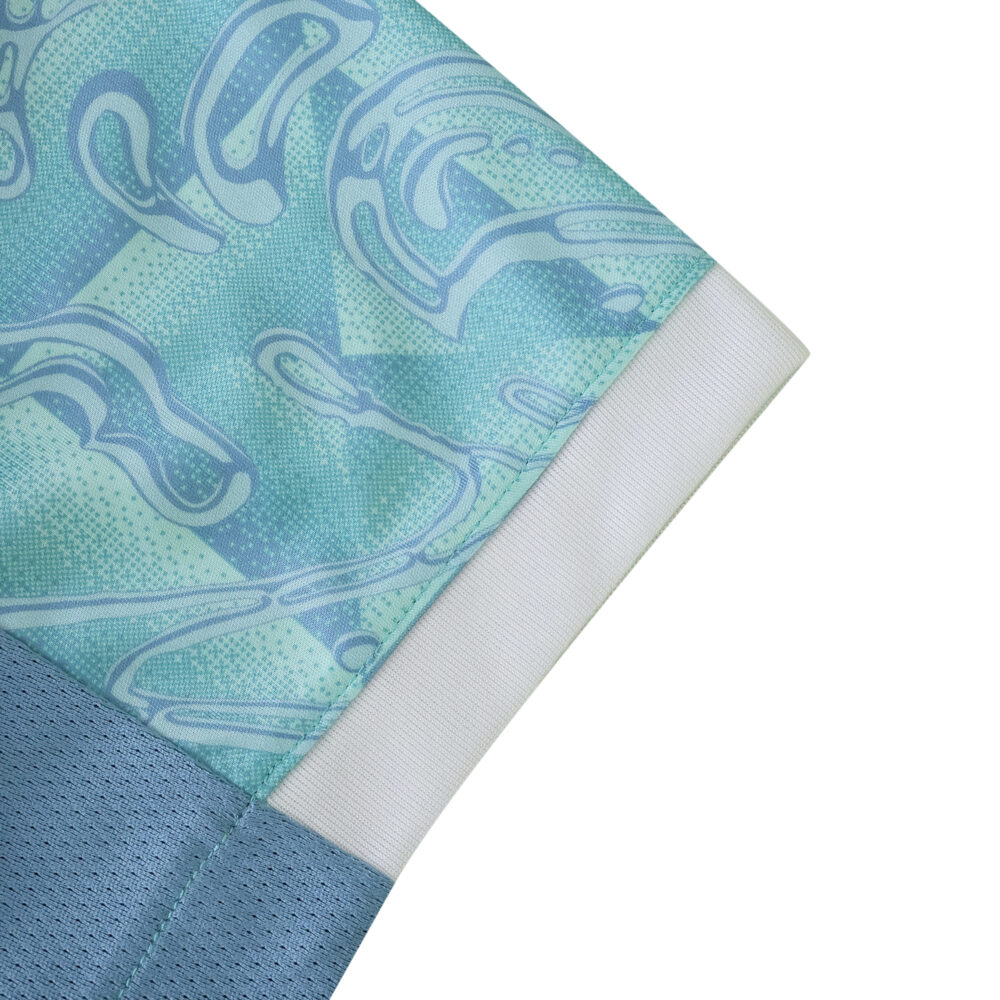 Close-up of the sleeve detail on the Juventus 2025/26 away fan jersey in blue and teal tones.