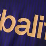Close-up of LA Galaxy Away 2025/26 Fan Version jersey, showing gold lettering on dark blue striped fabric.