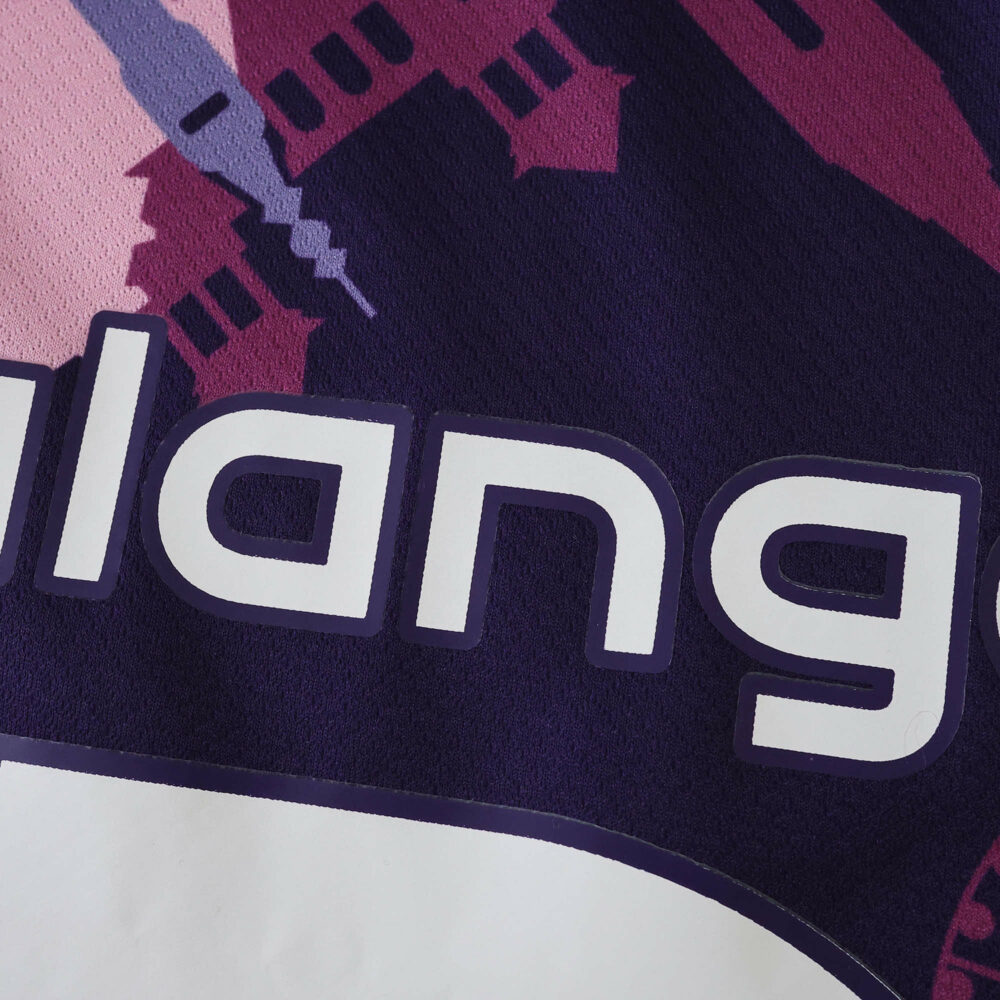 Close-up of Lille LOSC Away 2025/26 Fan Version jersey fabric showing part of the printed design and text.