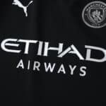 Close-up of Manchester City Away 2025/26 Player Version jersey with Puma and Etihad Airways logos.