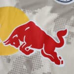 Close-up of the Red Bull logo on the New York Red Bulls 2025/26 Away Fan Version jersey fabric.