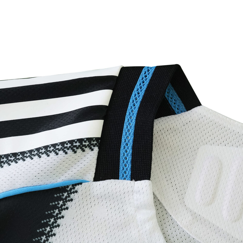 Close-up of Newcastle United Home 2025/26 Player Version collar with black, white, and blue details.
