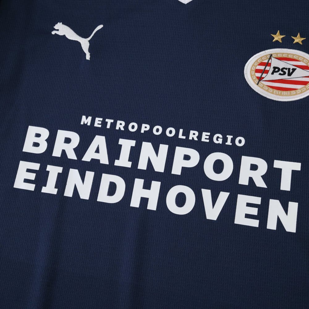 Close-up of PSV Eindhoven Away 2025/26 Fan Version jersey featuring sponsor and club badge.