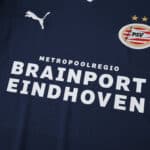 Close-up of PSV Eindhoven Away 2025/26 Fan Version jersey featuring sponsor and club badge.