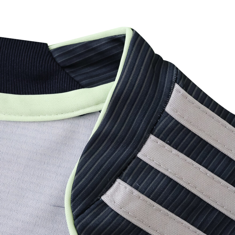 Close-up of the Real Madrid Away 2025/26 Fan Version jersey collar and shoulder with striped detail.