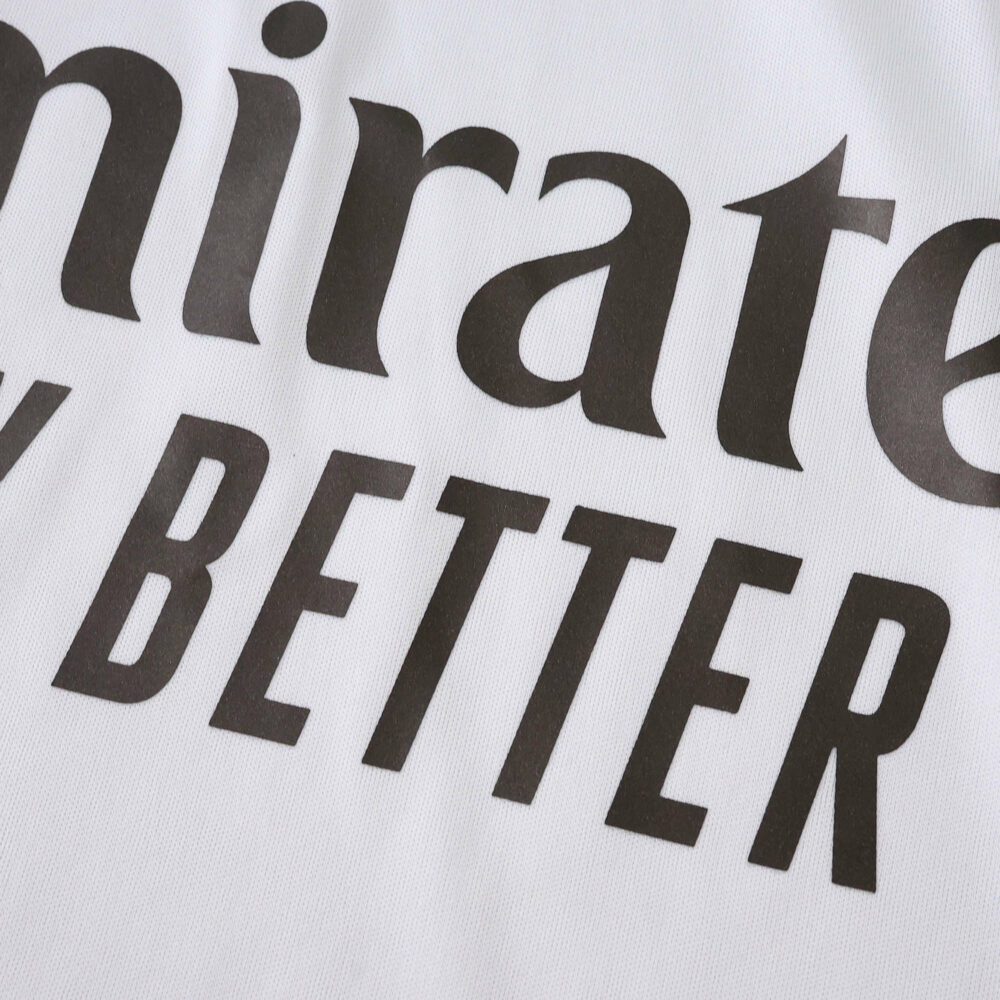 Close-up of the "Fly Better" sponsor logo on the 2025/26 Real Madrid Home Fan Version jersey.