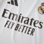 Close-up of the 2025/26 Real Madrid Home Player Version jersey with sponsor and club logo.