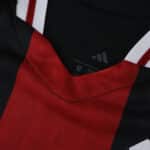 Close-up of the River Plate 2025/26 Away Player Version jersey collar, featuring red and black colors.