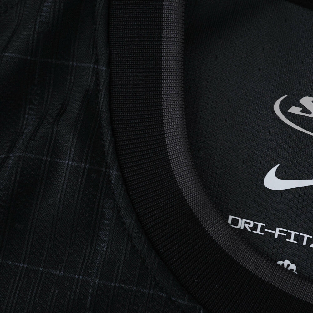 Close-up of the collar and inside label on the Tottenham Hotspur 2025/26 away player version jersey.