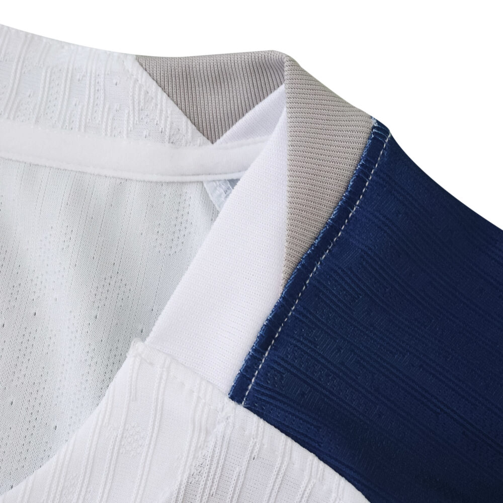 Close-up of the collar on the Tottenham Hotspur 2025/26 Home Player Version jersey, showing texture and colors.