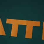 Close-up of yellow "ATT" lettering on the green Werder Bremen 2025/26 Third Fan Version jersey fabric.