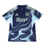 Ajax Away 2025/26 Fan Version jersey in navy blue with light blue abstract wave patterns and Ziggo sponsor logo.