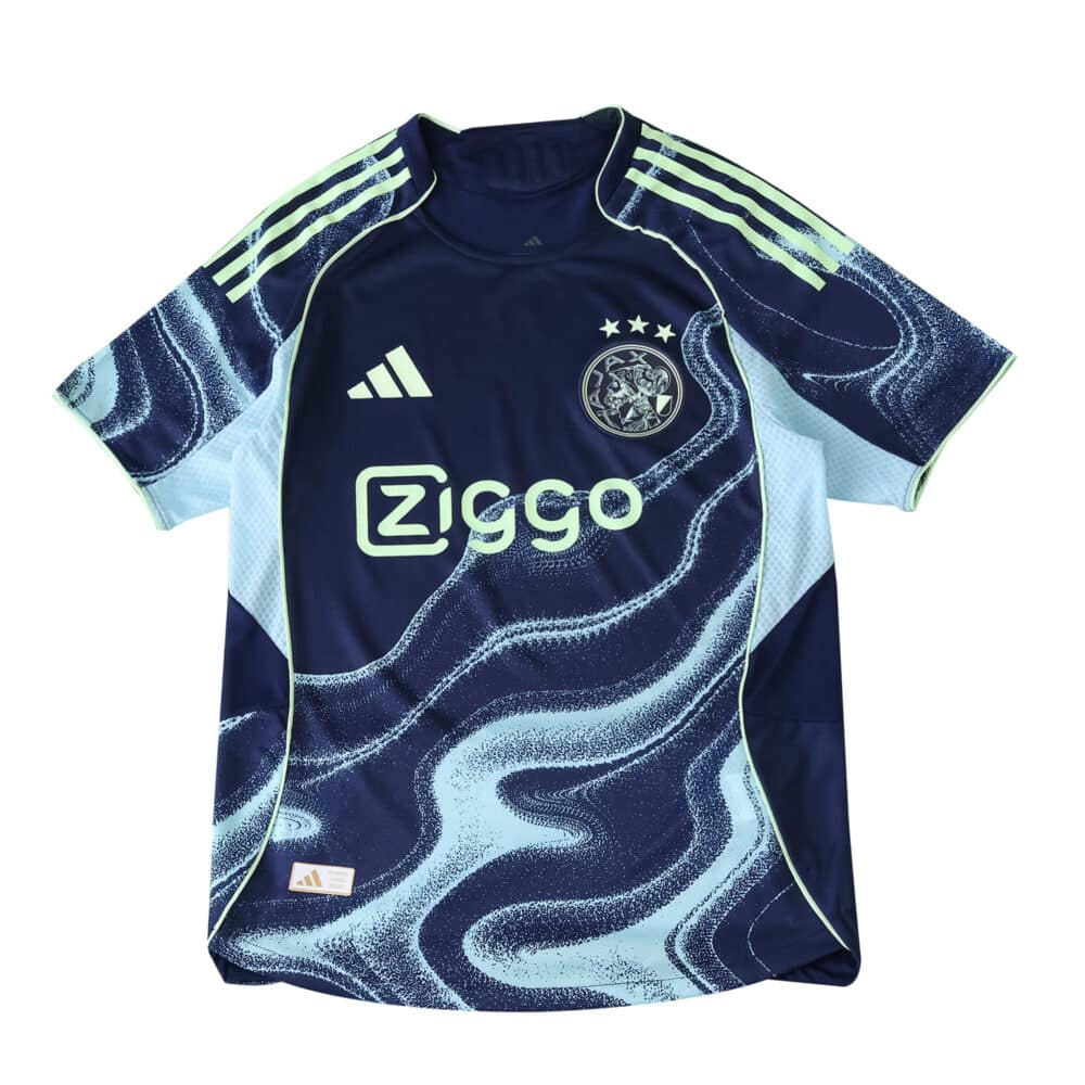 Ajax Away 2025/26 Player Version jersey in navy with light blue wave patterns and Ziggo sponsor logo.