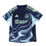 Ajax Away 2025/26 Player Version jersey in navy with light blue wave patterns and Ziggo sponsor logo.