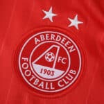 Aberdeen FC 2025/26 home fan jersey badge with two stars on red fabric.