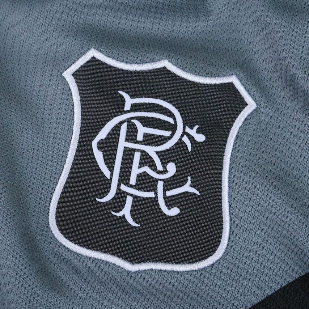 Close-up of the Rangers FC crest on the 2025/26 Third Fan Version jersey in grey and black.