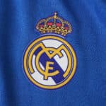Real Madrid crest on blue 2025/26 Third Player Version jersey fabric.