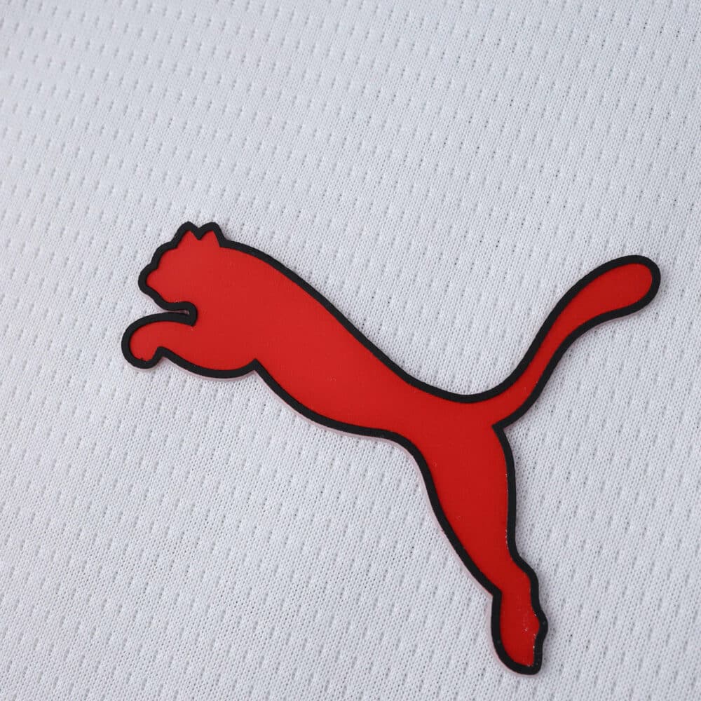 Red Puma logo on white AC Milan Away 2025/26 Fan Version jersey fabric.