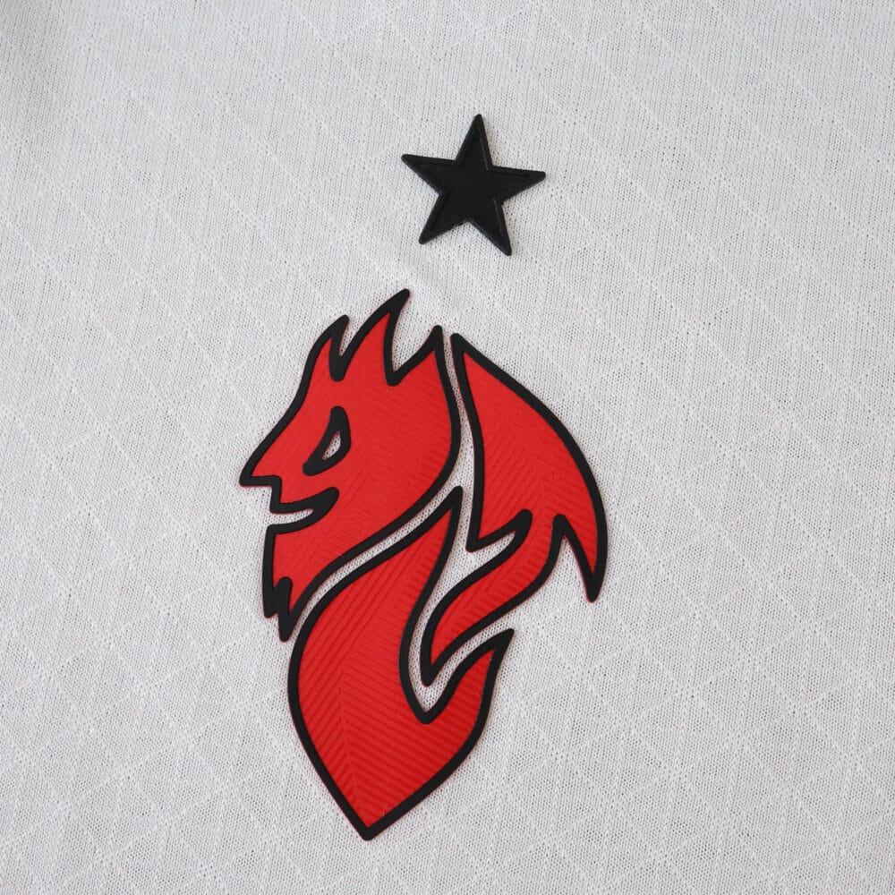 Close-up of the 2025/26 AC Milan Away Player Version jersey with red devil crest and black star.