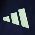 Close-up of the Adidas logo on the Ajax Away 2025/26 Player Version jersey fabric.