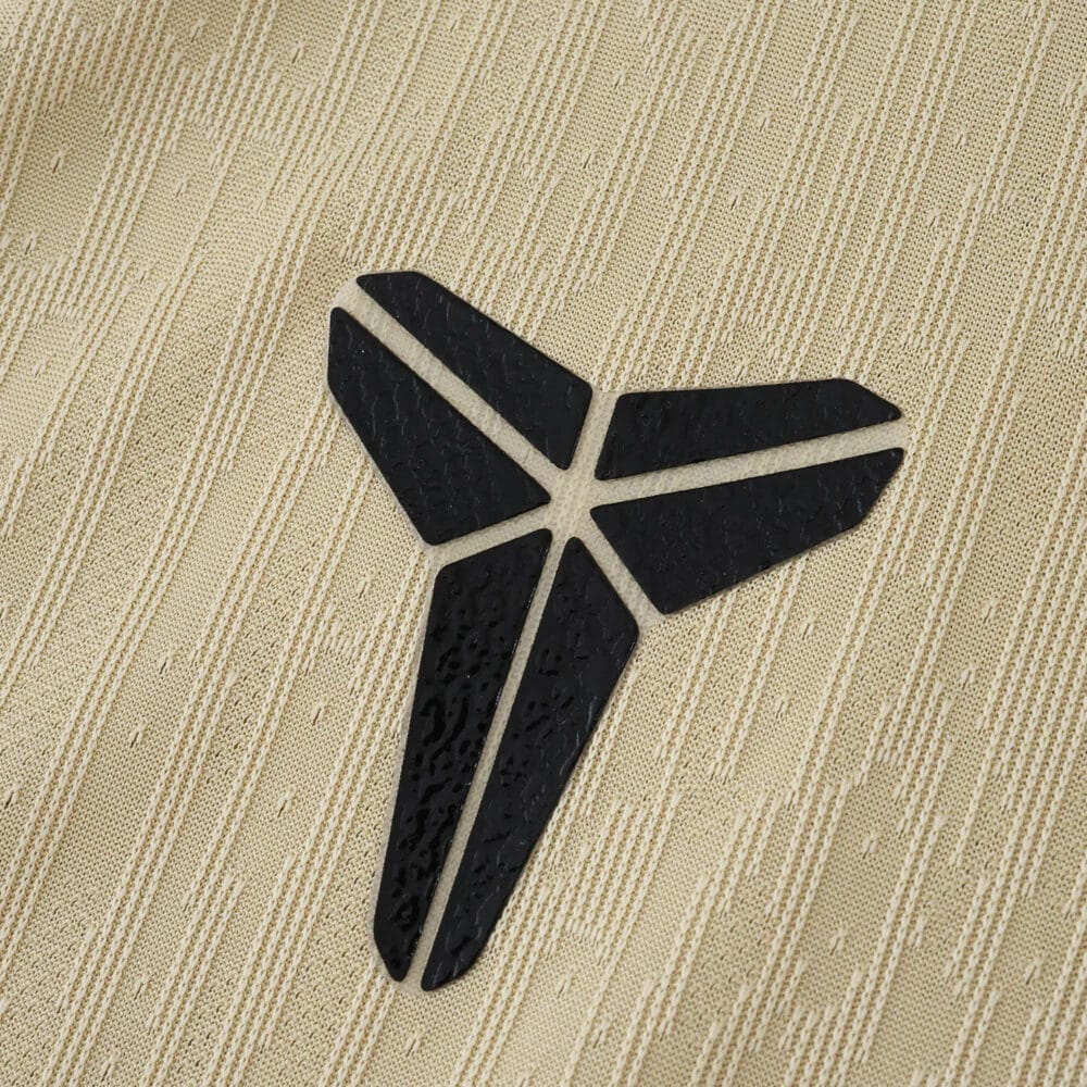 Close-up of the black Nike logo on the Barcelona 2025/26 away player version jersey fabric.