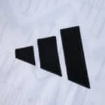 Close-up of the black adidas logo on the 2025/26 Fulham Home Fan Version jersey.