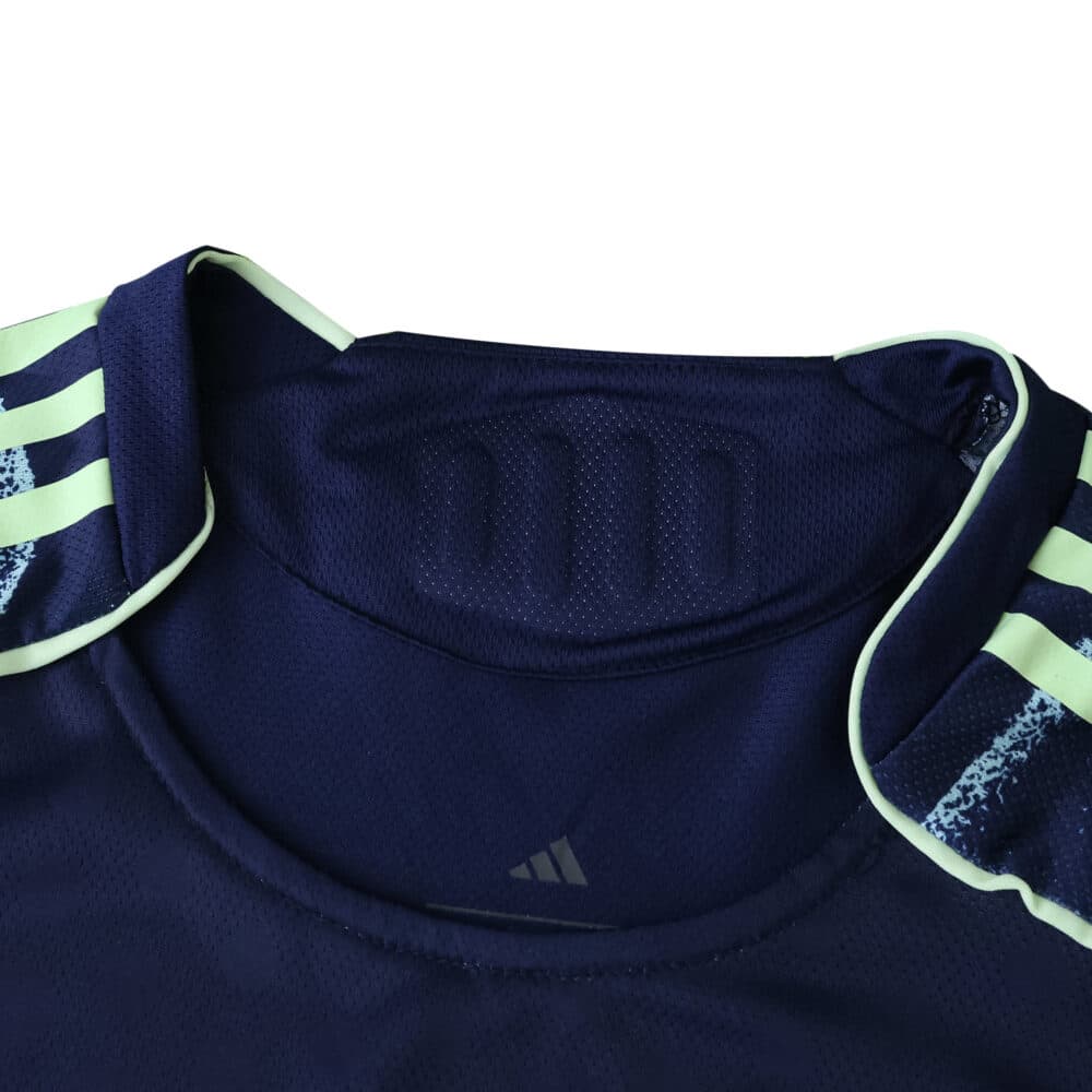Close-up of Ajax Away 2025/26 Player Version jersey collar with Adidas logo and striped shoulder detail.