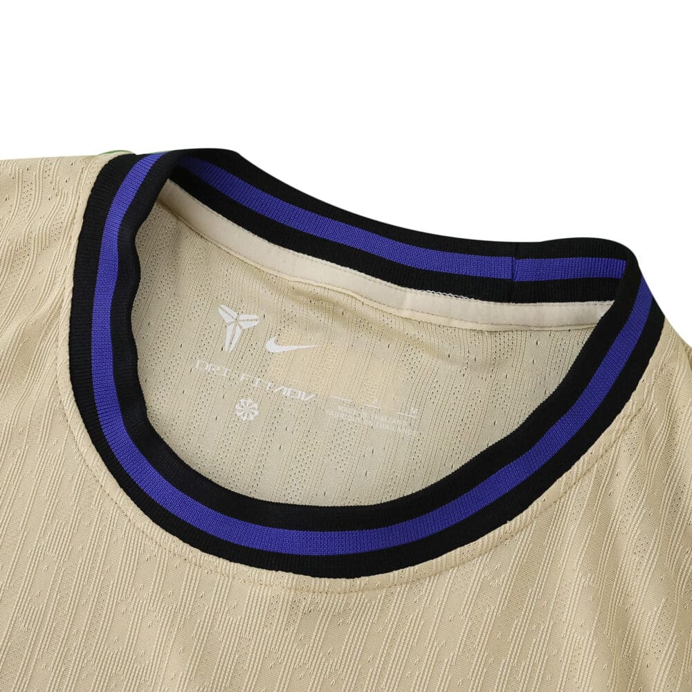 Close-up of the collar on the Barcelona Away 2025/26 Player Version jersey, featuring blue and black trim.