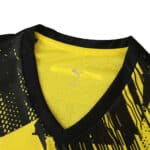 Close-up of Borussia Dortmund 2025/26 Home Player Version jersey collar and chest with PUMA logo.