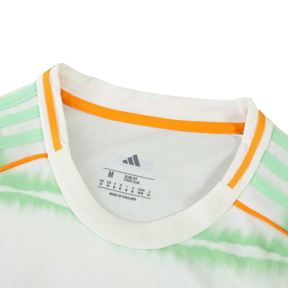 Close-up of the Celtic Third 2025/26 Fan Version jersey collar with orange and green accents.