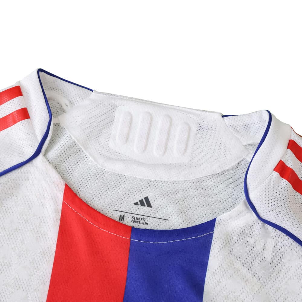 Close-up of the Olympique Lyonnais 2025/26 home player version jersey collar and shoulder details.