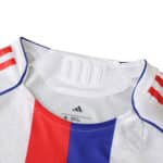 Close-up of the Olympique Lyonnais 2025/26 home player version jersey collar and shoulder details.