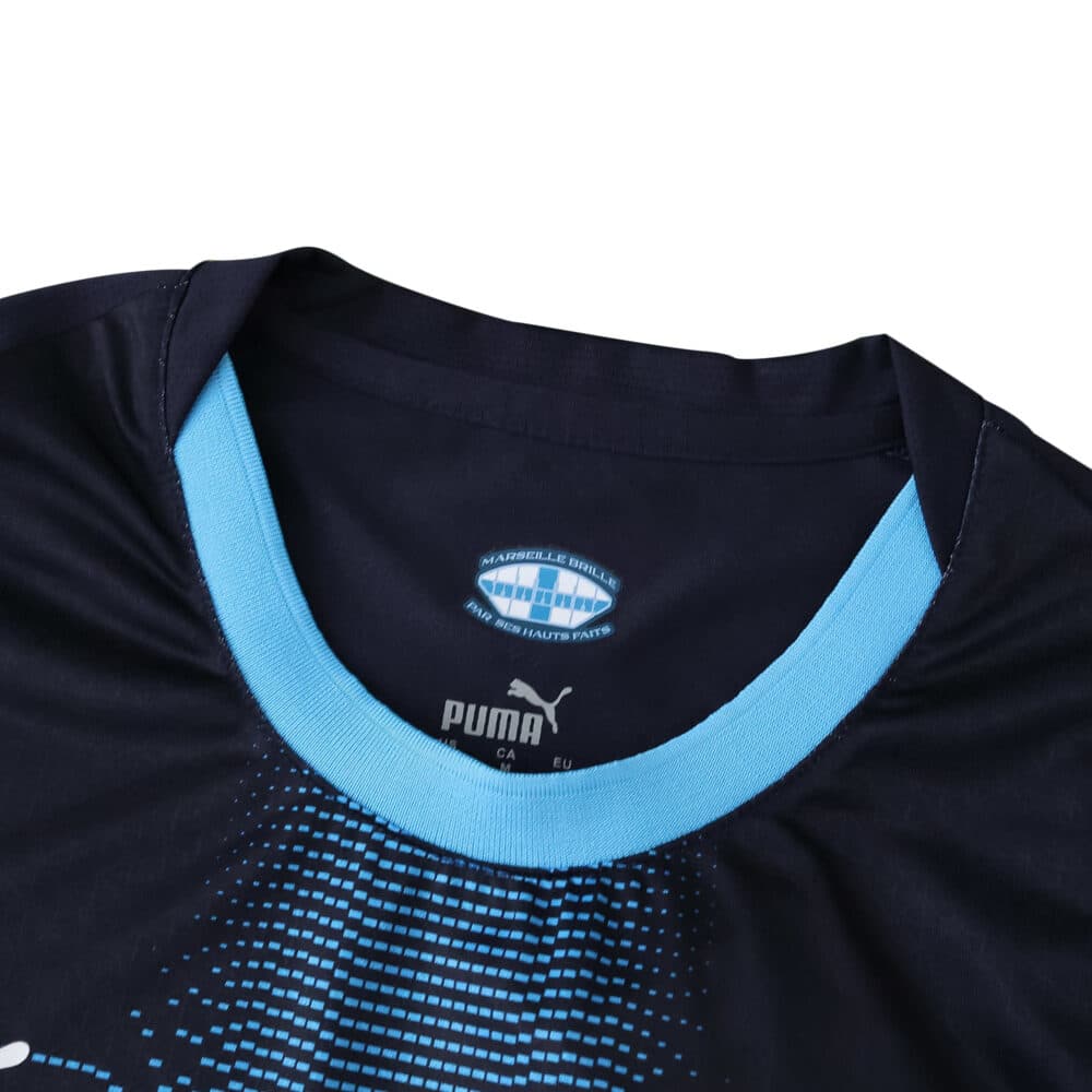 Close-up of Olympique Marseille 2025/26 Away Player Version jersey collar with club and Puma logos.