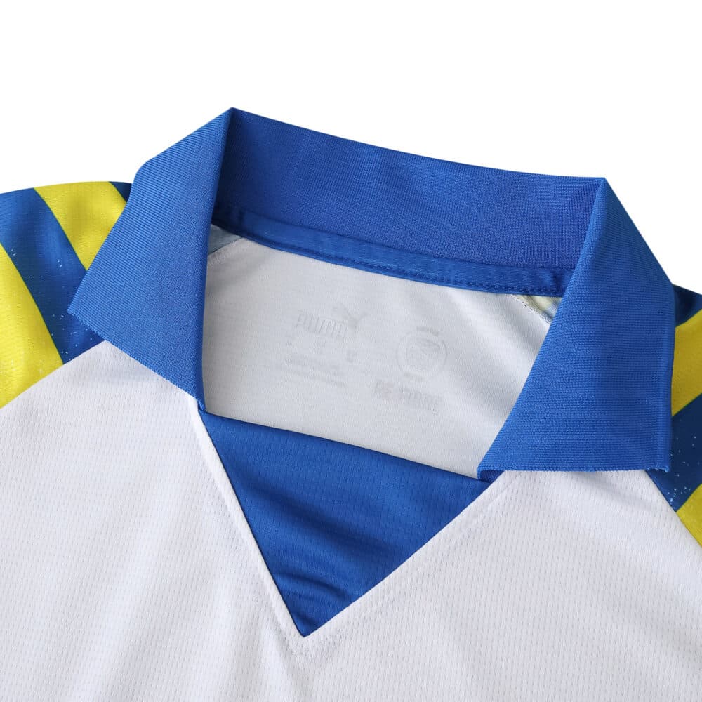 Close-up of the collar and upper chest of the Parma Third 2025/26 Fan Version jersey in blue, yellow, and white.