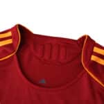 Close-up of the collar and shoulder detail on the Roma Home 2025/26 Player Version jersey.