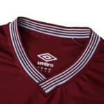 Close-up of West Ham United 2025/26 Home Fan Version jersey collar with Umbro logo.