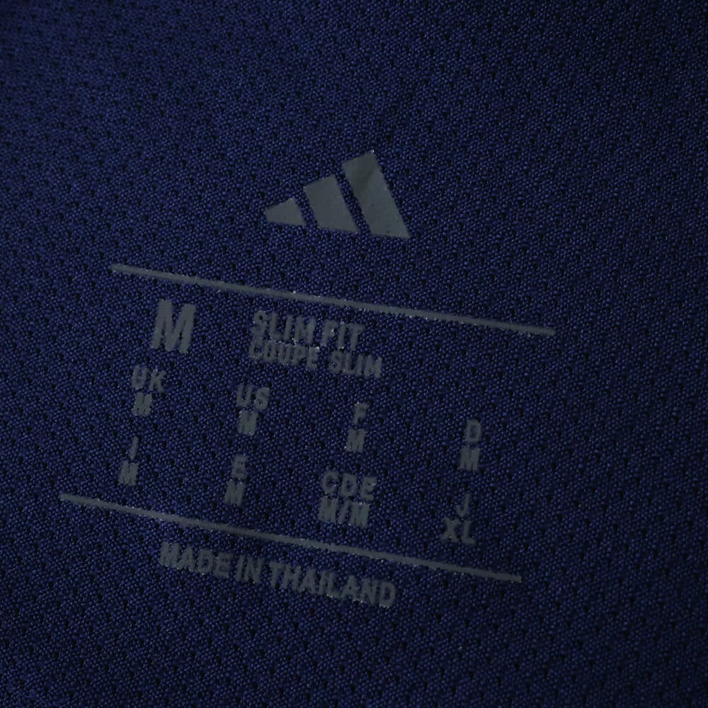 Close-up of the inner collar label on the Ajax Away 2025/26 Player Version jersey, showing size and care details.