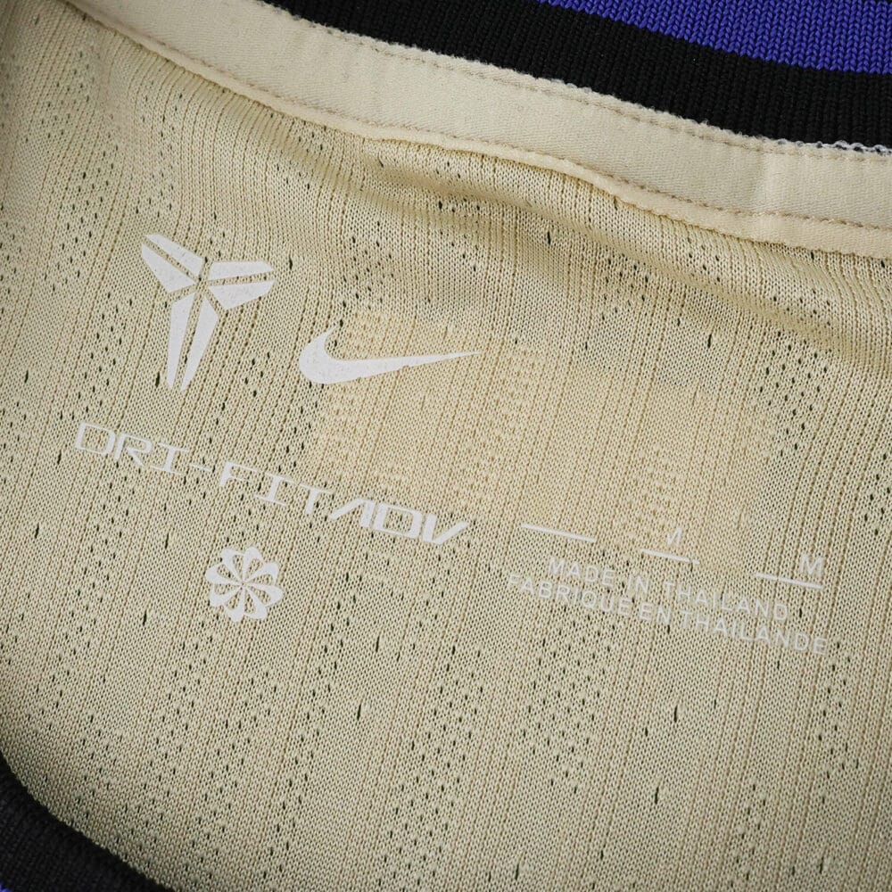 Close-up of the inner collar on the Barcelona Away 2025/26 Player Version jersey, showing logo details.