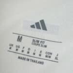 Close-up of the inner label on the Celtic Third 2025/26 Fan Version shirt, showing size and fit details.