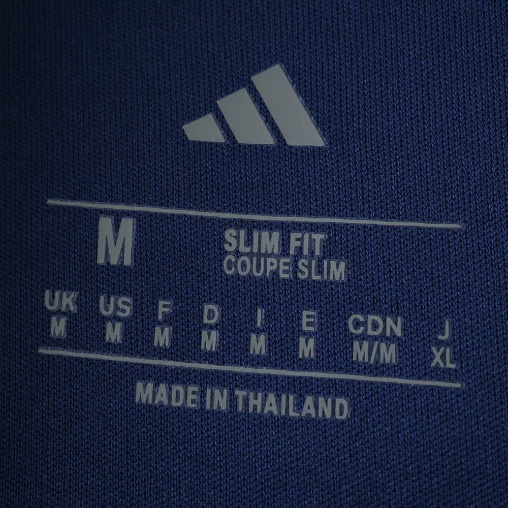 Size label inside Fenerbahce Home 2025/26 Fan Version jersey showing medium, slim fit, made in Thailand.