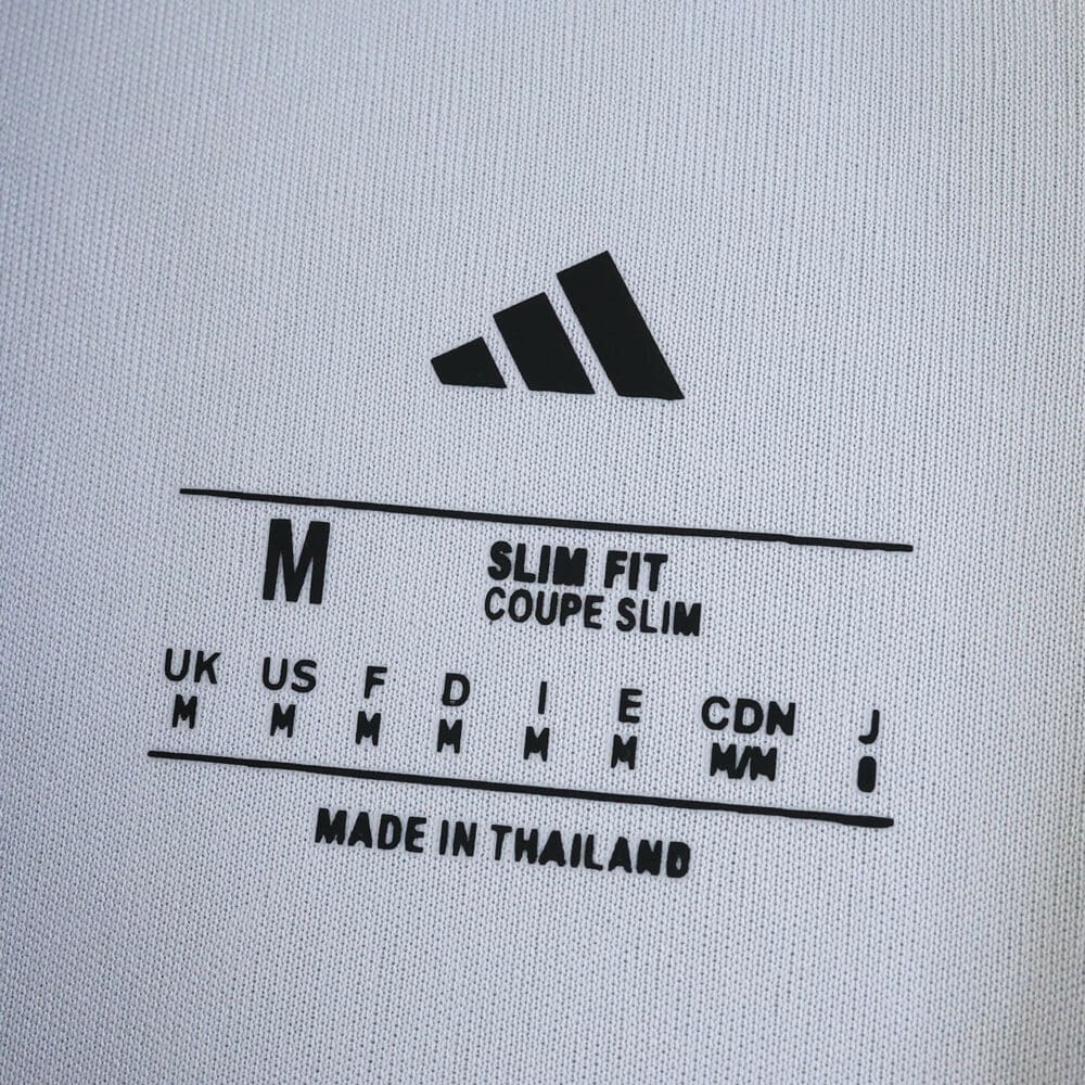 Size tag inside the Fulham Home 2025/26 Fan Version jersey showing medium size and slim fit.