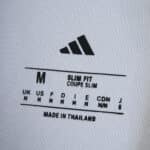 Size tag inside the Fulham Home 2025/26 Fan Version jersey showing medium size and slim fit.