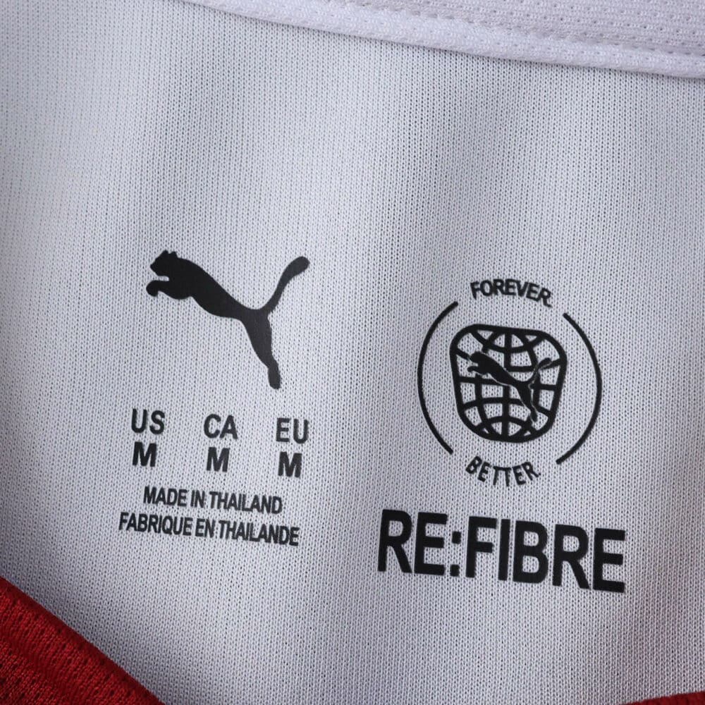 Close-up of inside collar tag on the Galatasaray Away 2025/26 Fan Version jersey showing Puma and RE:FIBRE logos.