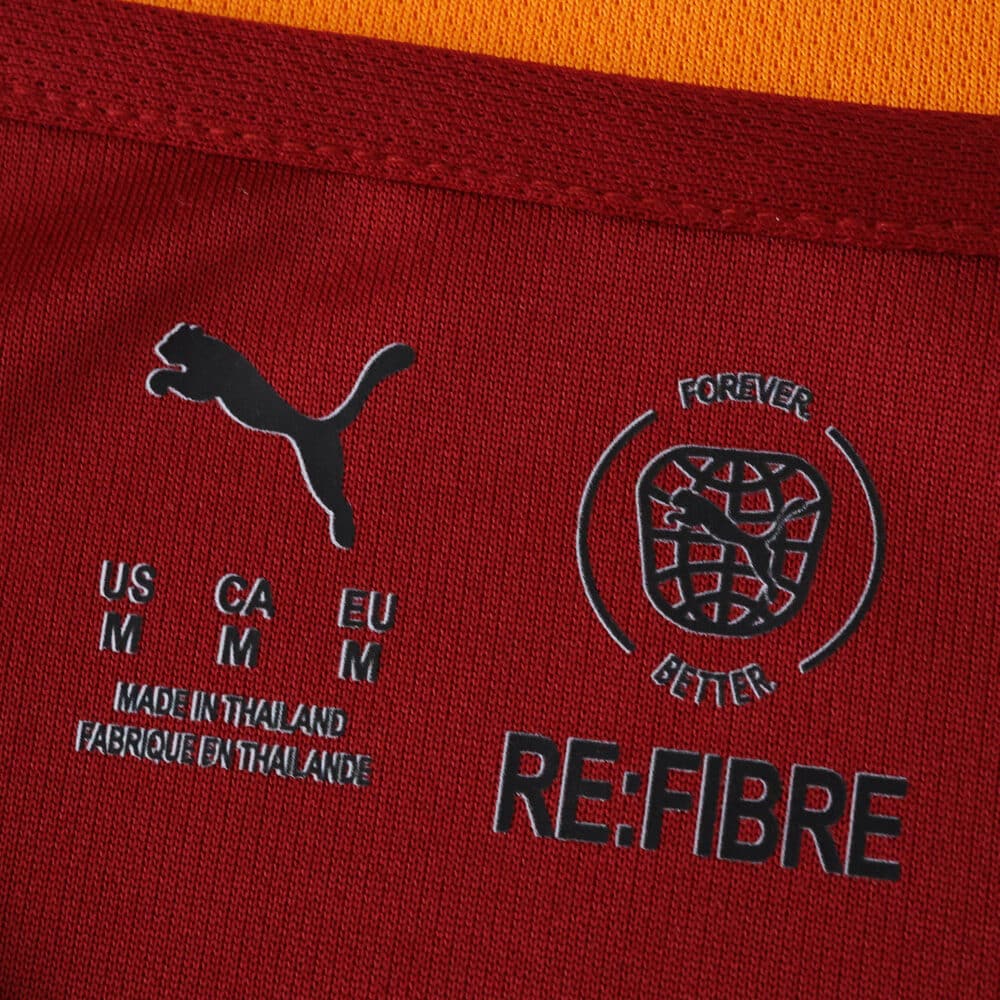 Close-up of collar tag on Galatasaray 2025/26 Home Jersey Fan Version with Puma and RE:FIBRE logos.