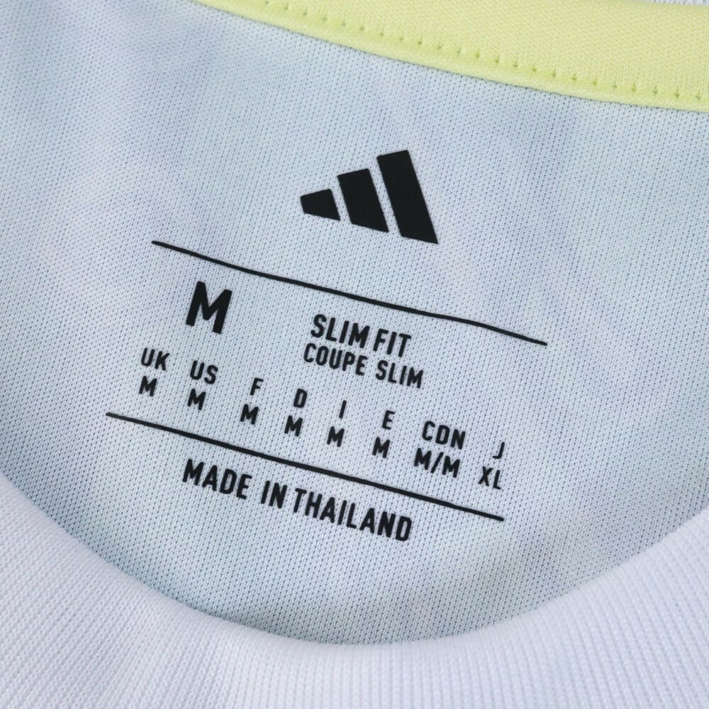 Juventus Away 2025/26 Fan Version collar tag showing size, fit details, and Adidas logo.