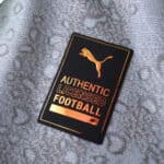 Close-up of the official Puma Authentic Licensed Football badge on Manchester City Third 2025/26 Player Version shirt.