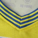Close-up of the Parma Away 2025/26 Fan Version jersey collar, featuring yellow and blue stripes.