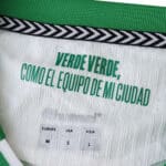 Inside collar detail of Real Betis 2025/26 Home Player Jersey with "Verde Verde, Como El Equipo De Mi Ciudad" text.